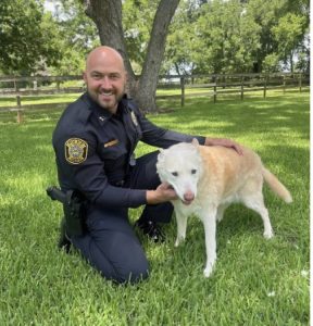 Captain Greg Suter and his dog, Ella
